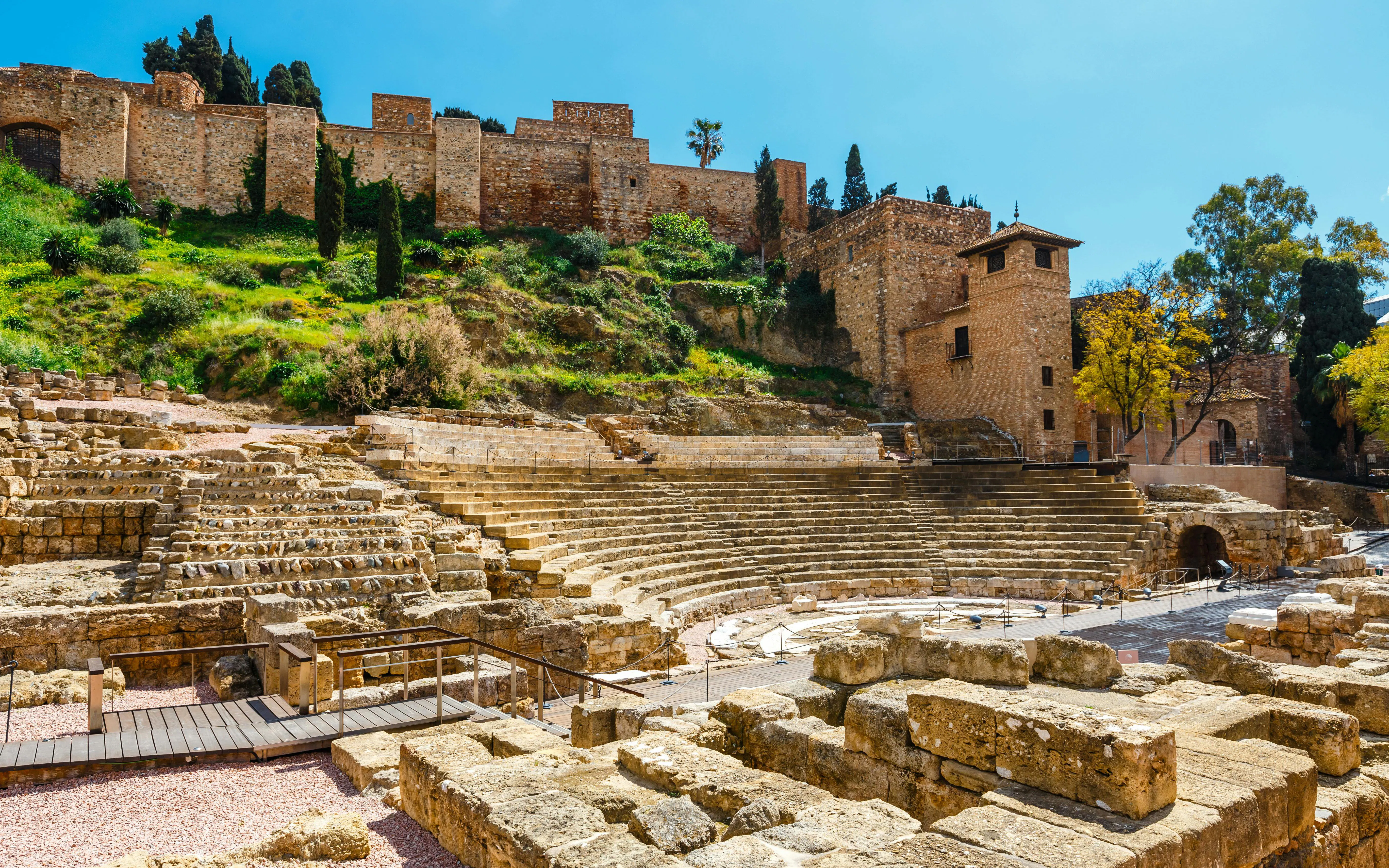Roman Theatre ruins with Gibralfaro Castle in the background, Malaga, Spain.