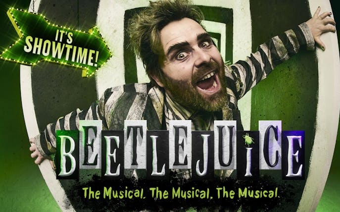 Beetlejuice musical poster with character in striped suit and "It's Showtime" sign.