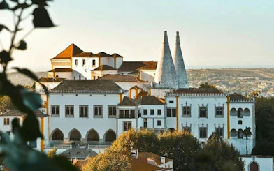 Sintra National Palace with iconic chimneys on a private half-day tour from Lisbon.