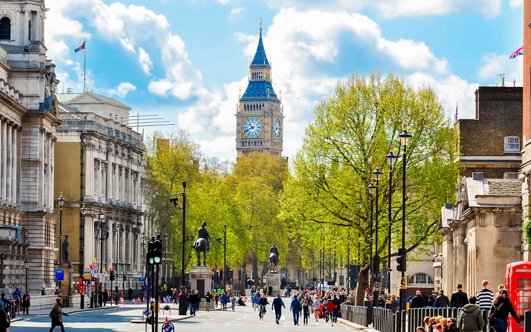 Westminster Abbey street view with Big Ben in the background, London.