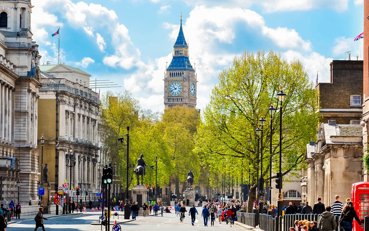 Westminster Abbey street view with Big Ben in the background, London.