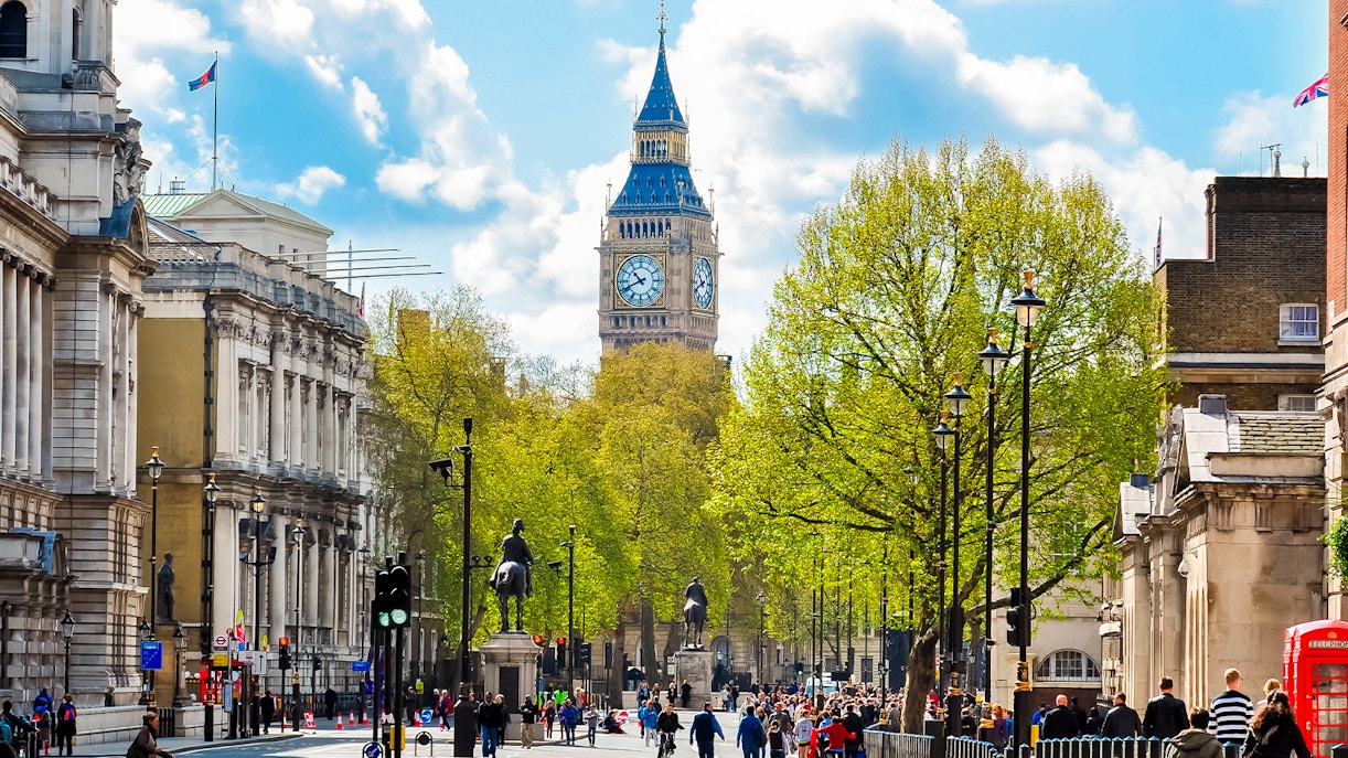 Westminster Abbey street view with Big Ben in the background, London.