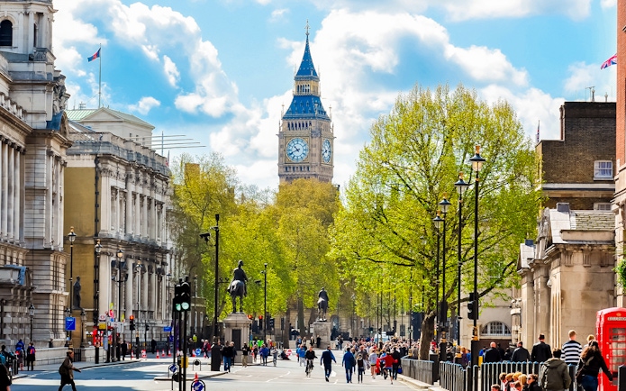 Westminster Abbey street view with Big Ben in the background, London.