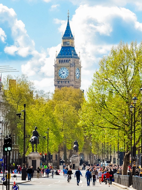 Westminster Abbey street view with Big Ben in the background, London.