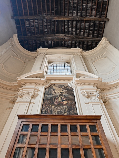 San Lorenzo Maggiore interior with ornate architecture and fresco in Naples, Italy.