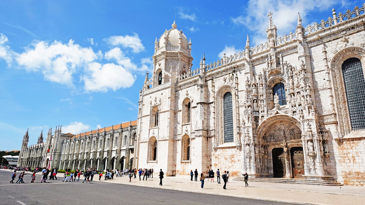 Visitors entering Jeronimos Monastery in Lisbon, Portugal.