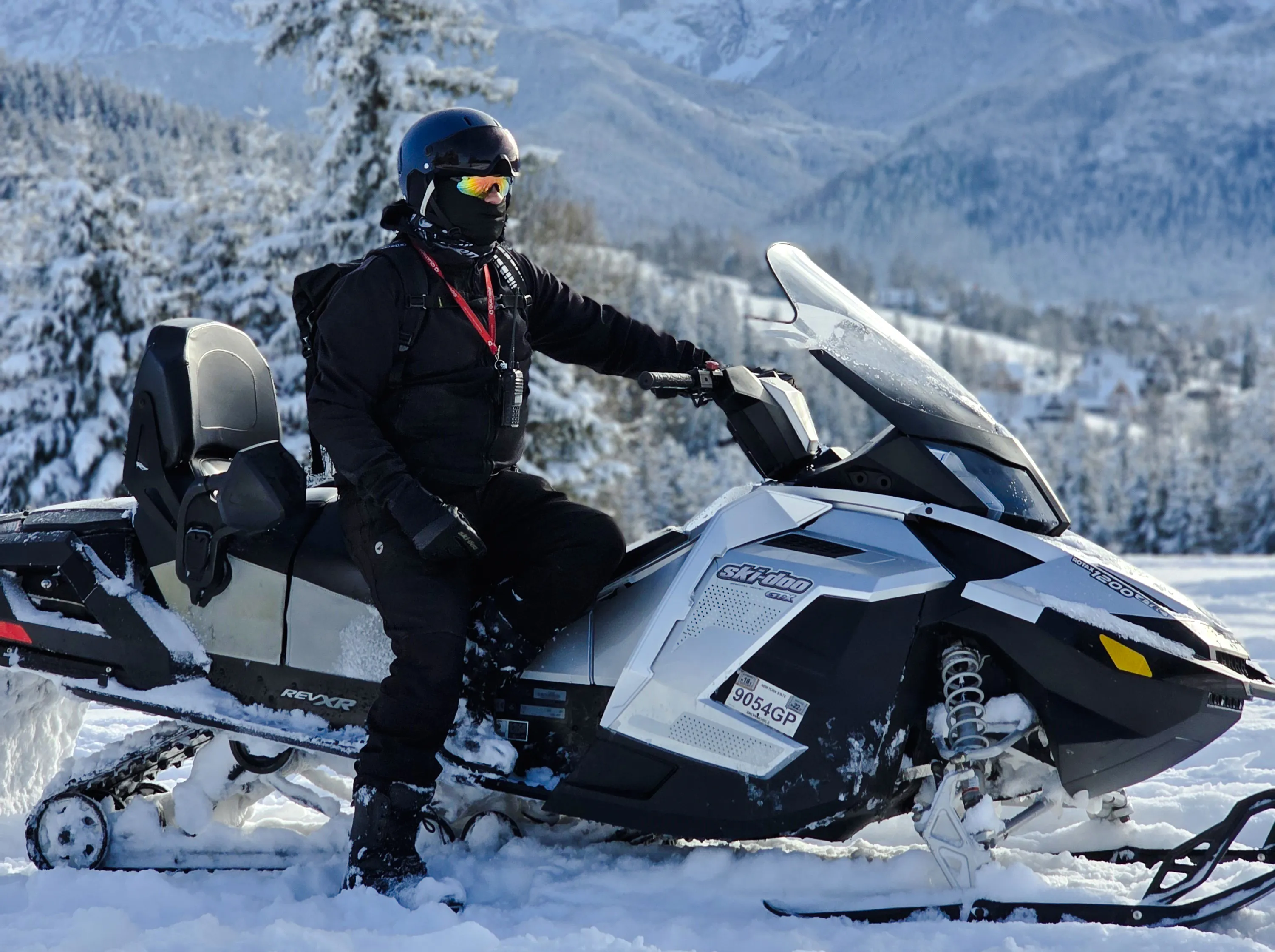 Snowmobile rider in snowy Zakopane landscape during Krakow tour.