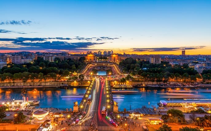 View of Trocadéro Gardens and Seine River from Eiffel Tower's 1st floor at sunset, Paris.