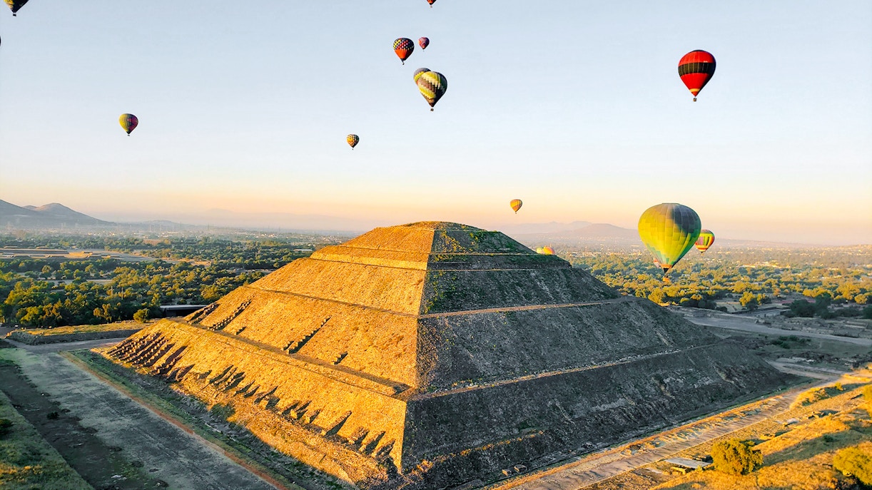 Hot air balloons over Pyramid of the Sun, Teotihuacan, Mexico.