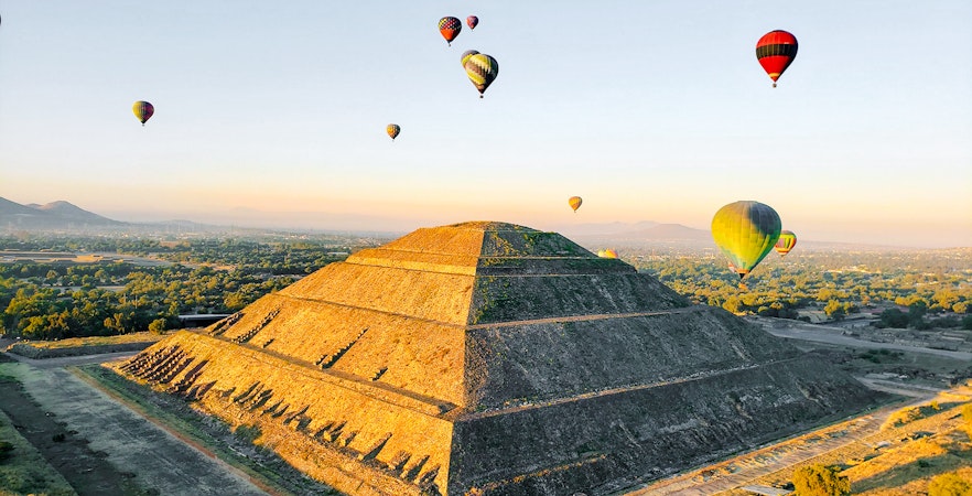 Hot air balloons over Pyramid of the Sun, Teotihuacan, Mexico.
