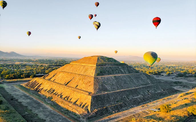 Hot air balloons over Pyramid of the Sun, Teotihuacan, Mexico.