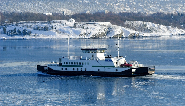 Oslo Fjord winter cruise with snow-covered islands and serene sea views.