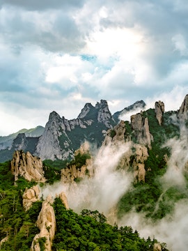 Seorak Mountain peaks with mist and lush greenery in South Korea.