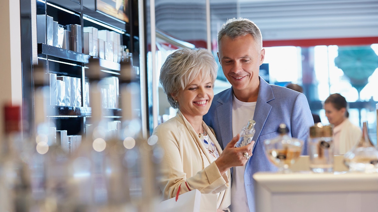 Couple shopping for perfume at Airport