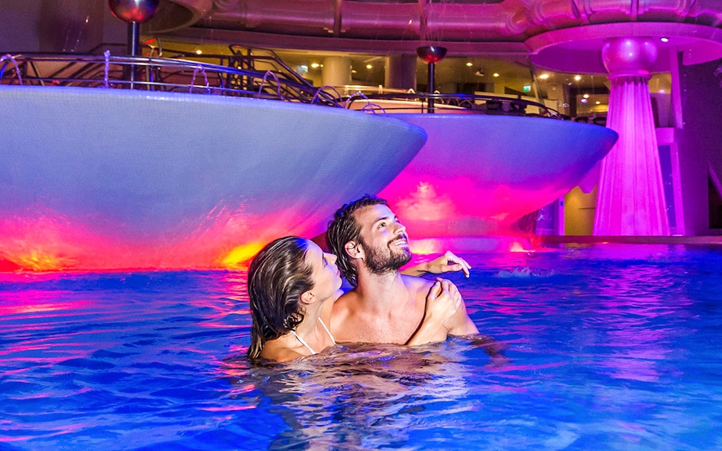 Visitors enjoying thermal pools at Caldea spa, Escaldes-Engordany, Andorra.