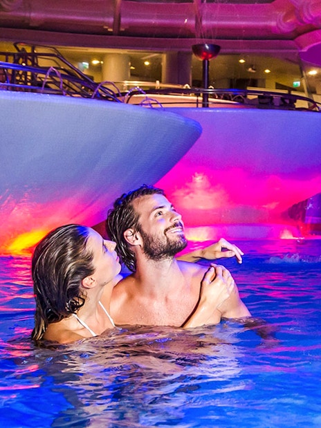 Visitors enjoying thermal pools at Caldea spa, Escaldes-Engordany, Andorra.