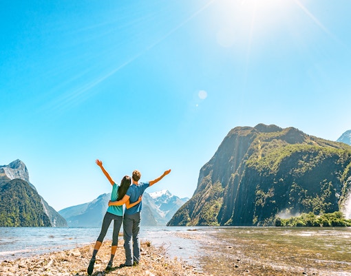Tourists hiking in Milford Sound