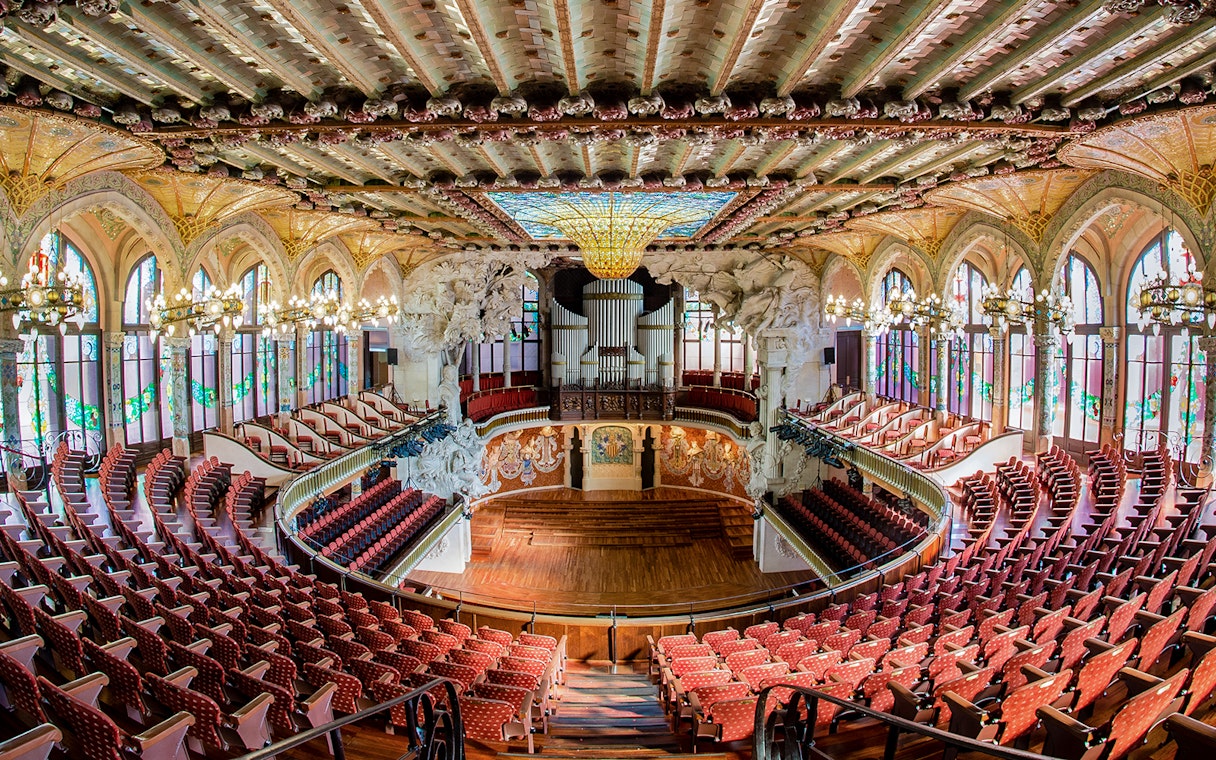 Concert Hall interior at Palau de la Música Catalana, Barcelona, featuring ornate architecture and seating.