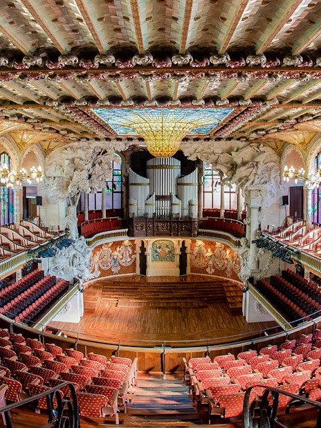 Concert Hall interior at Palau de la Música Catalana, Barcelona, featuring ornate architecture and seating.