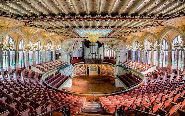 Concert Hall interior at Palau de la Música Catalana, Barcelona, featuring ornate architecture and seating.