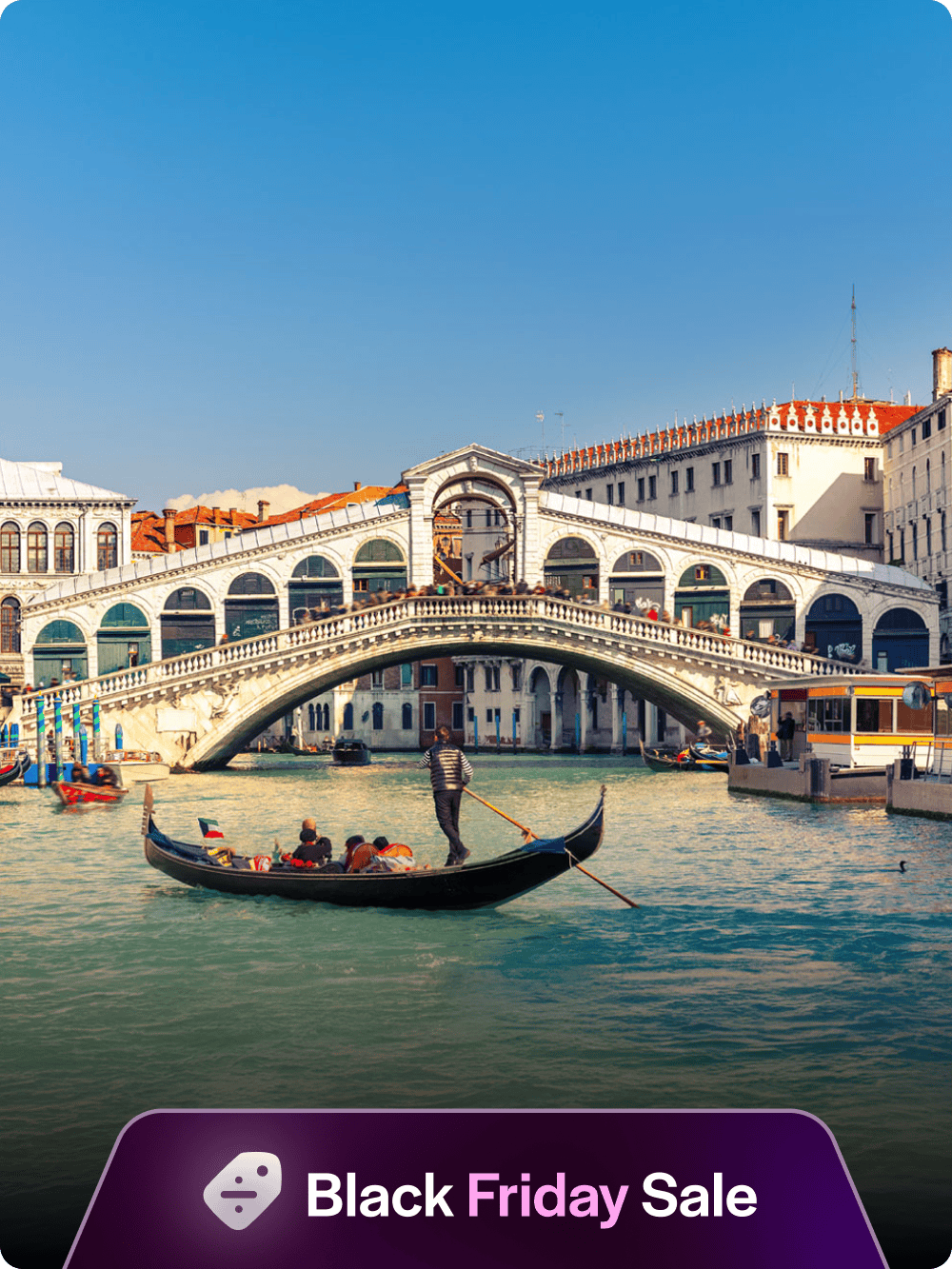 Gondola on the Grand Canal near Rialto Bridge, Venice.