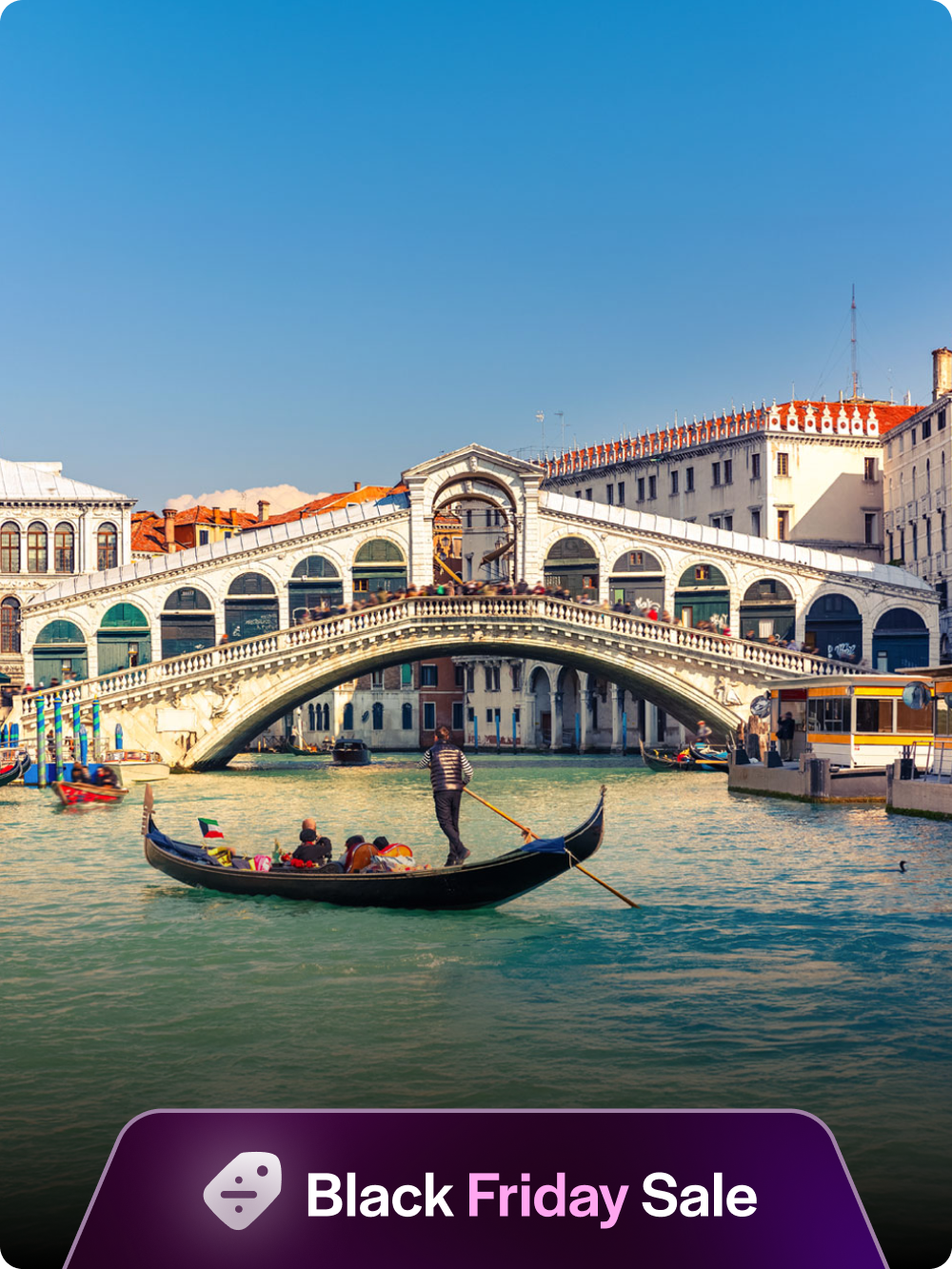 Gondola on the Grand Canal near Rialto Bridge, Venice.