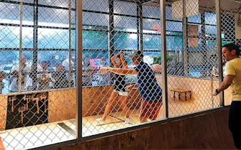 People axe throwing at Axe Factor in Sentosa.