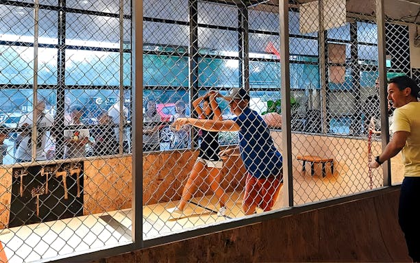 People axe throwing at Axe Factor in Sentosa.
