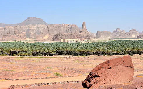 AlUla Old Town landscape with palm oasis and rocky mountains in Medina.