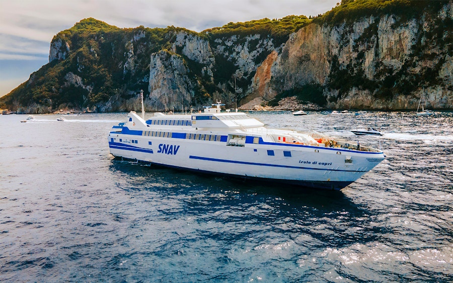 https://cdn-imgix.headout.com/media/images/e9a1fae575759a9aa48ac381a157ae6a-22309---Naples---Ferry-Transfers-Between-Naples---Capri---14.jpg?ar=16%3A10&auto=format&fit=crop&h=562.5&q=90&w=900