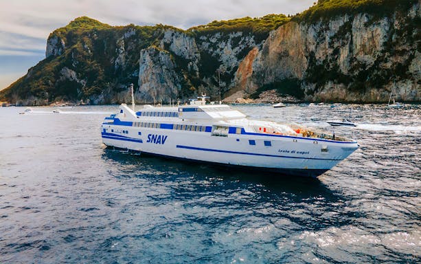 SNAV ferry sailing near Capri cliffs, route between Naples and Capri.