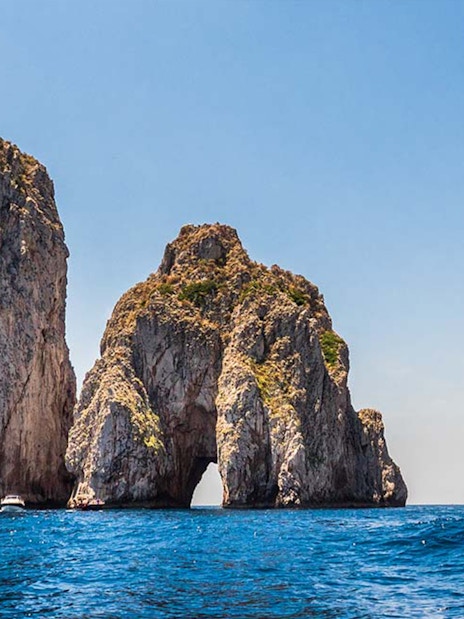 Faraglioni rock formations in Capri Island, Italy, viewed from the sea.