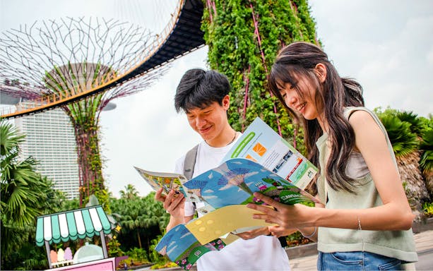 Participants reading maps during RANSACK PUZZLE HUNT: The Meltdown Menace at Gardens by the Bay, Singapore.