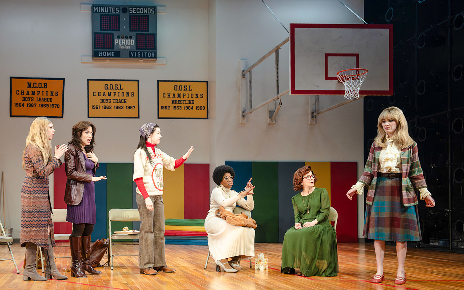 Actors performing a scene in a gymnasium setting during the Liberation Broadway show.