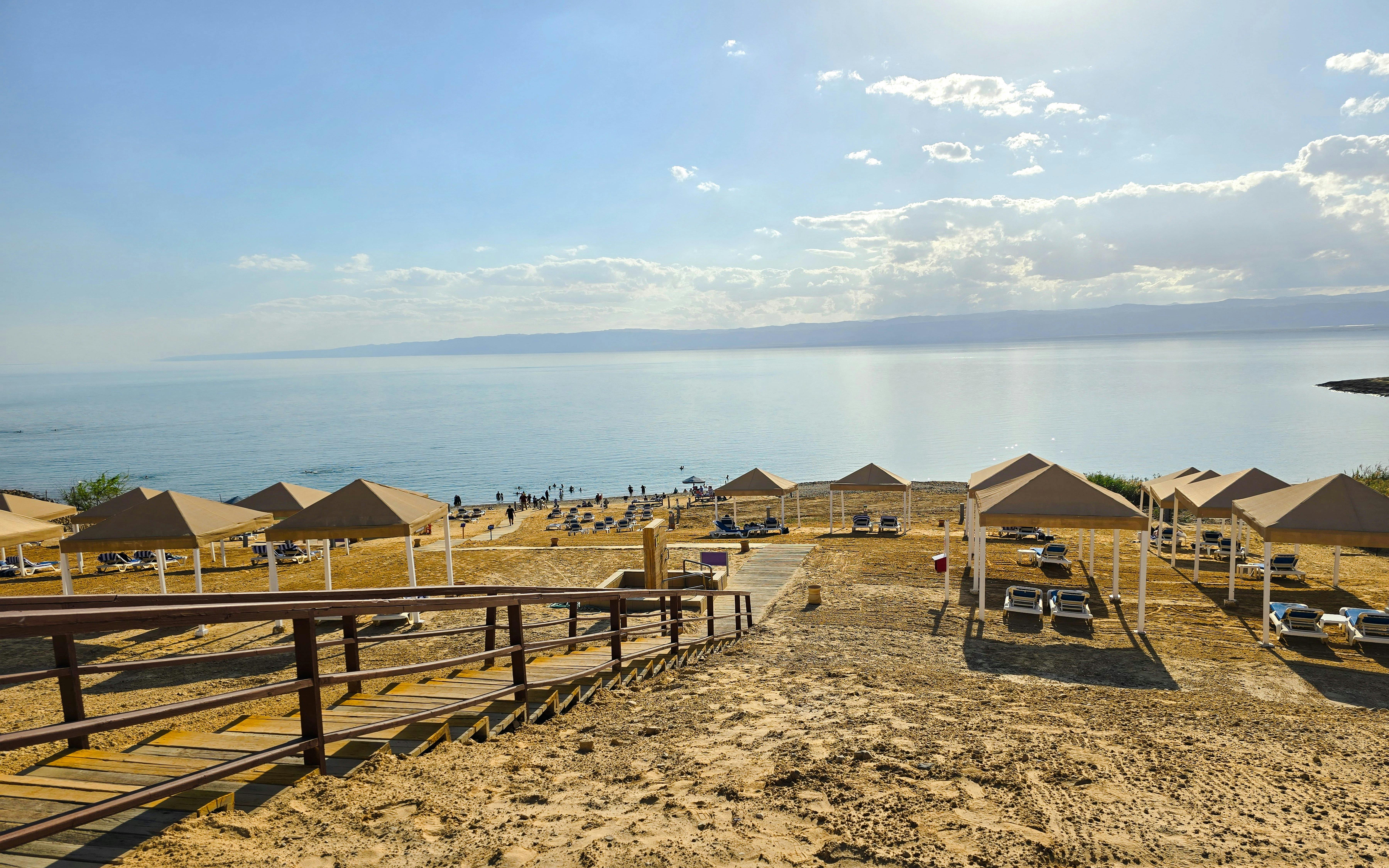 Beach resort cabanas overlooking the Dead Sea shoreline.