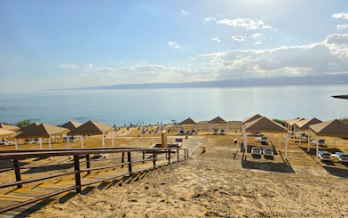 Beach resort cabanas overlooking the Dead Sea shoreline.