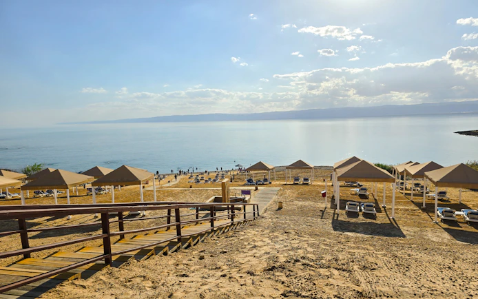 Beach resort cabanas overlooking the Dead Sea shoreline.