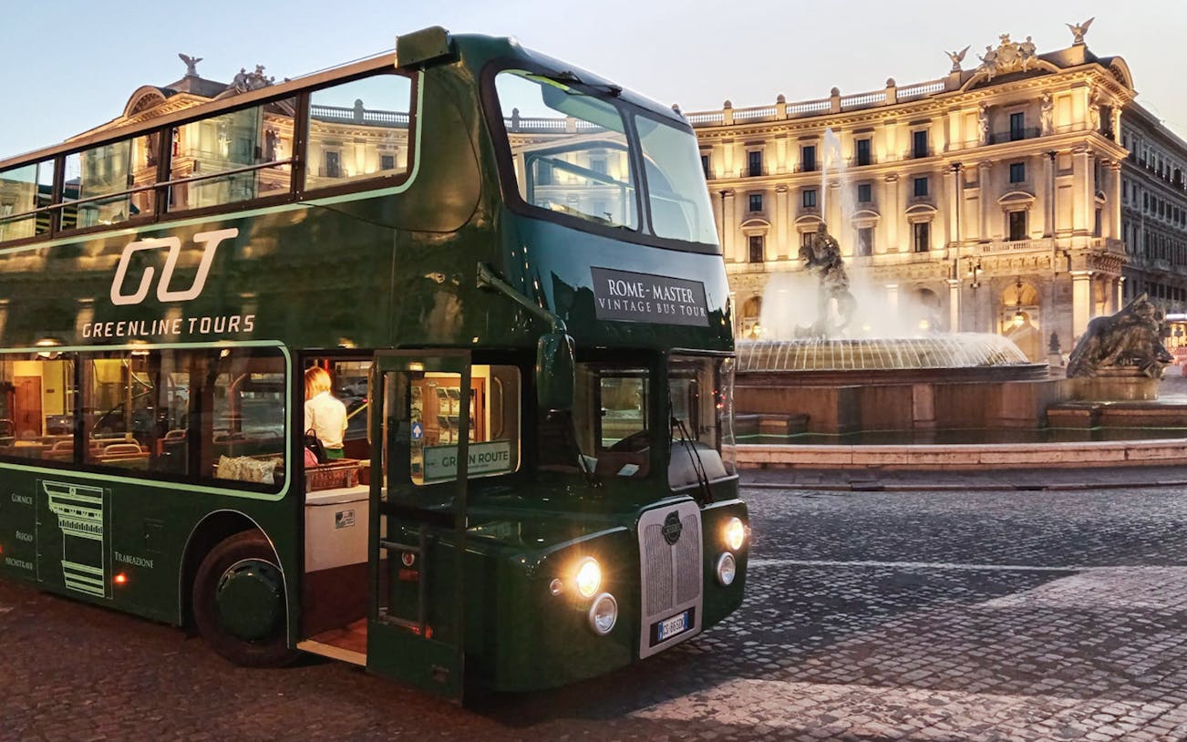 Vintage open-top double-decker bus in front of Piazza della Repubblica, Rome.