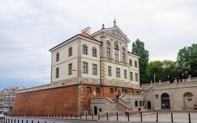 Frédéric Chopin Museum in Warsaw, Poland, with visitors on the steps.