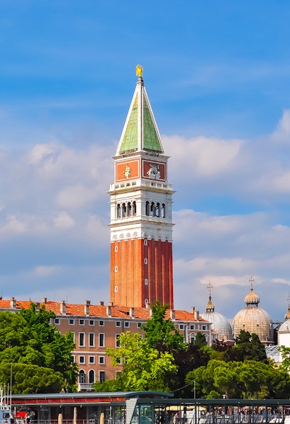 St. Mark Bell Tower in Venice with tourists admiring the view.