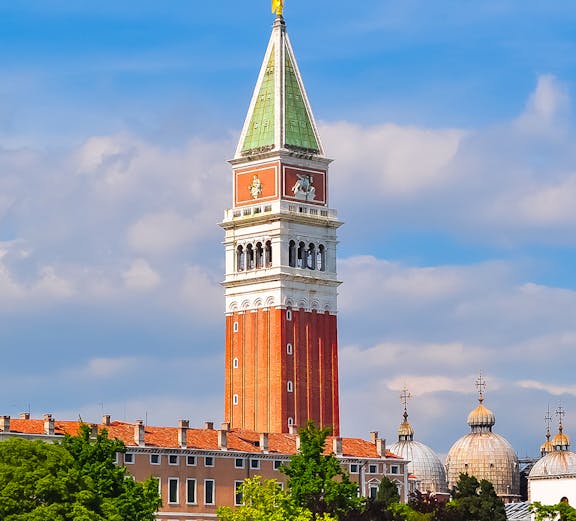St. Mark Bell Tower in Venice with tourists admiring the view.