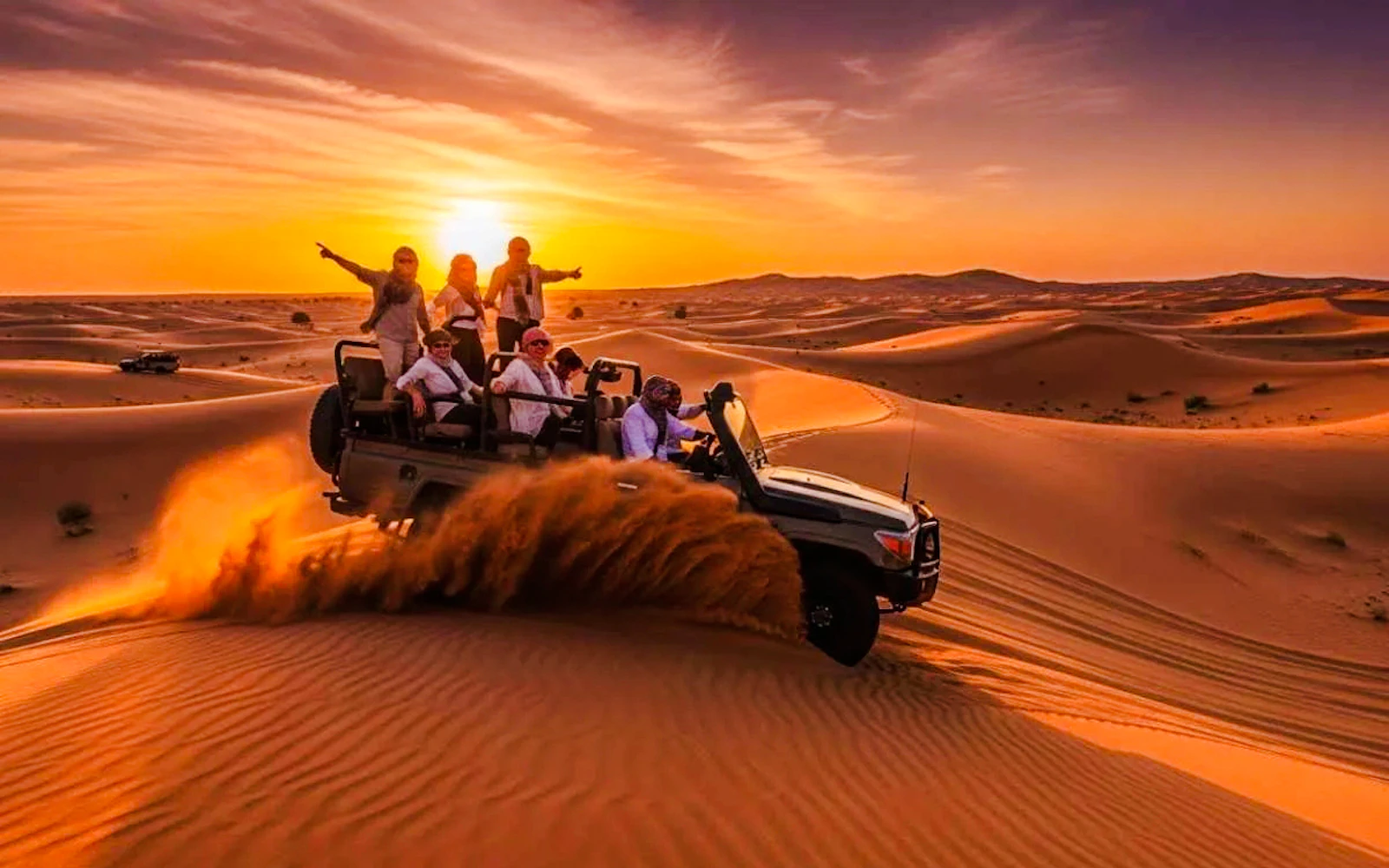 Dubai Red Dunes Desert Safari with BBQ Dinner, Camel Ride, Sandboarding and Hotel Transfers Image 2