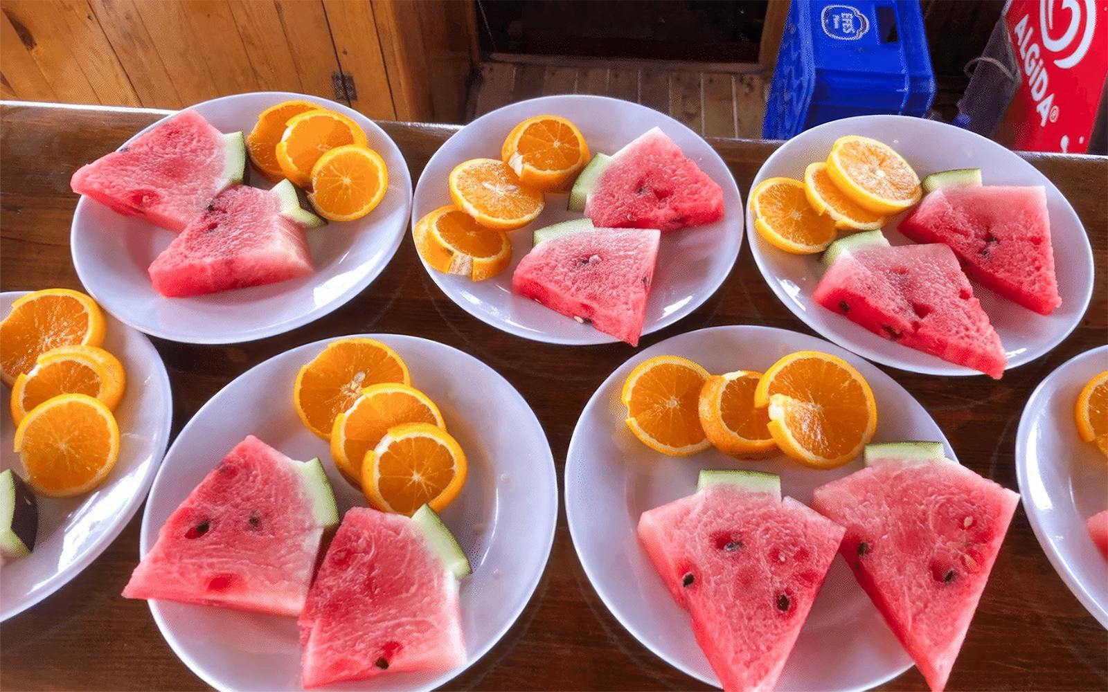 Plates of watermelon and orange slices on Alanya Relaxing Boat Tour.