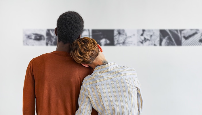 Couple viewing art exhibit in New York City museum.