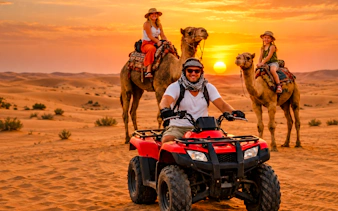 ATV rider and camel riders at sunset in Abu Dhabi desert safari.