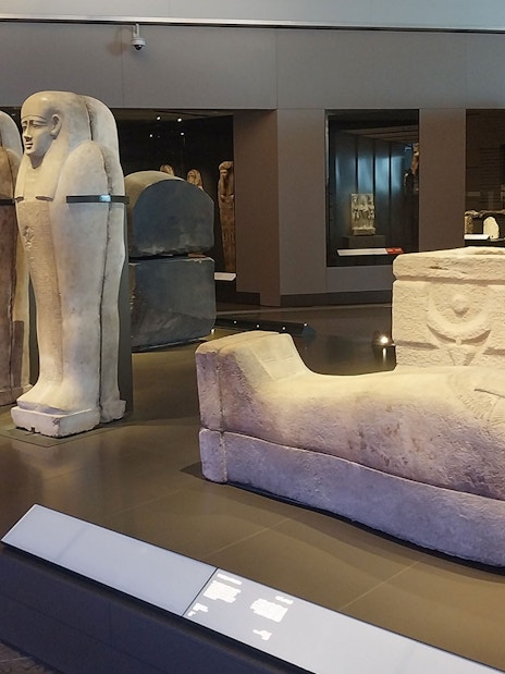 Ancient Egyptian sarcophagi displayed at the Grand Egyptian Museum.