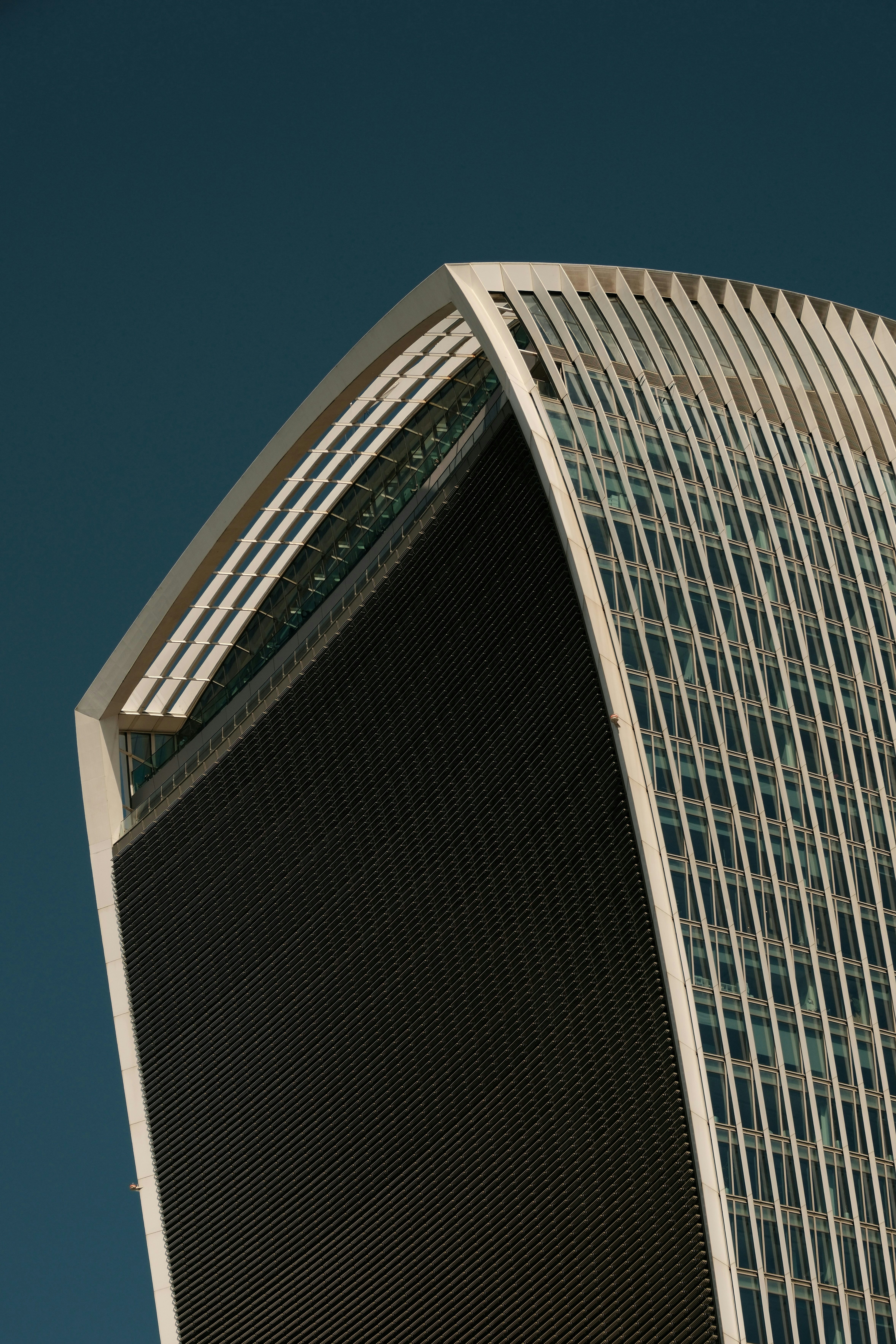 Exterior view of the Walkie Talkie building in London, featuring its unique curved design.