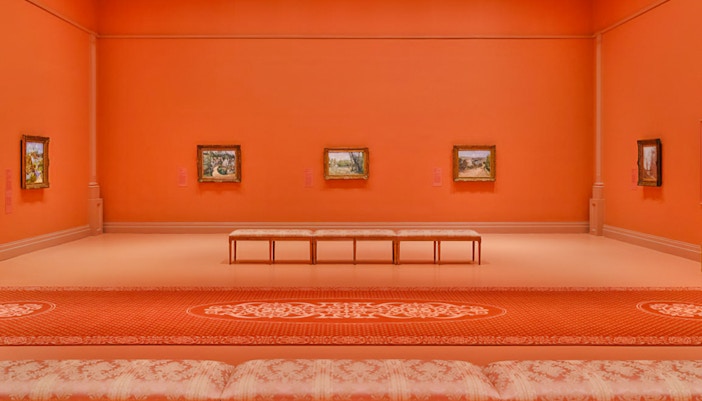 French Impressionist paintings displayed in an orange gallery at NGV, Melbourne Winter Masterpieces 2025.
