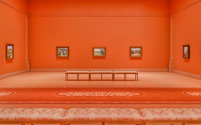 French Impressionist paintings displayed in an orange gallery at NGV, Melbourne Winter Masterpieces 2025.