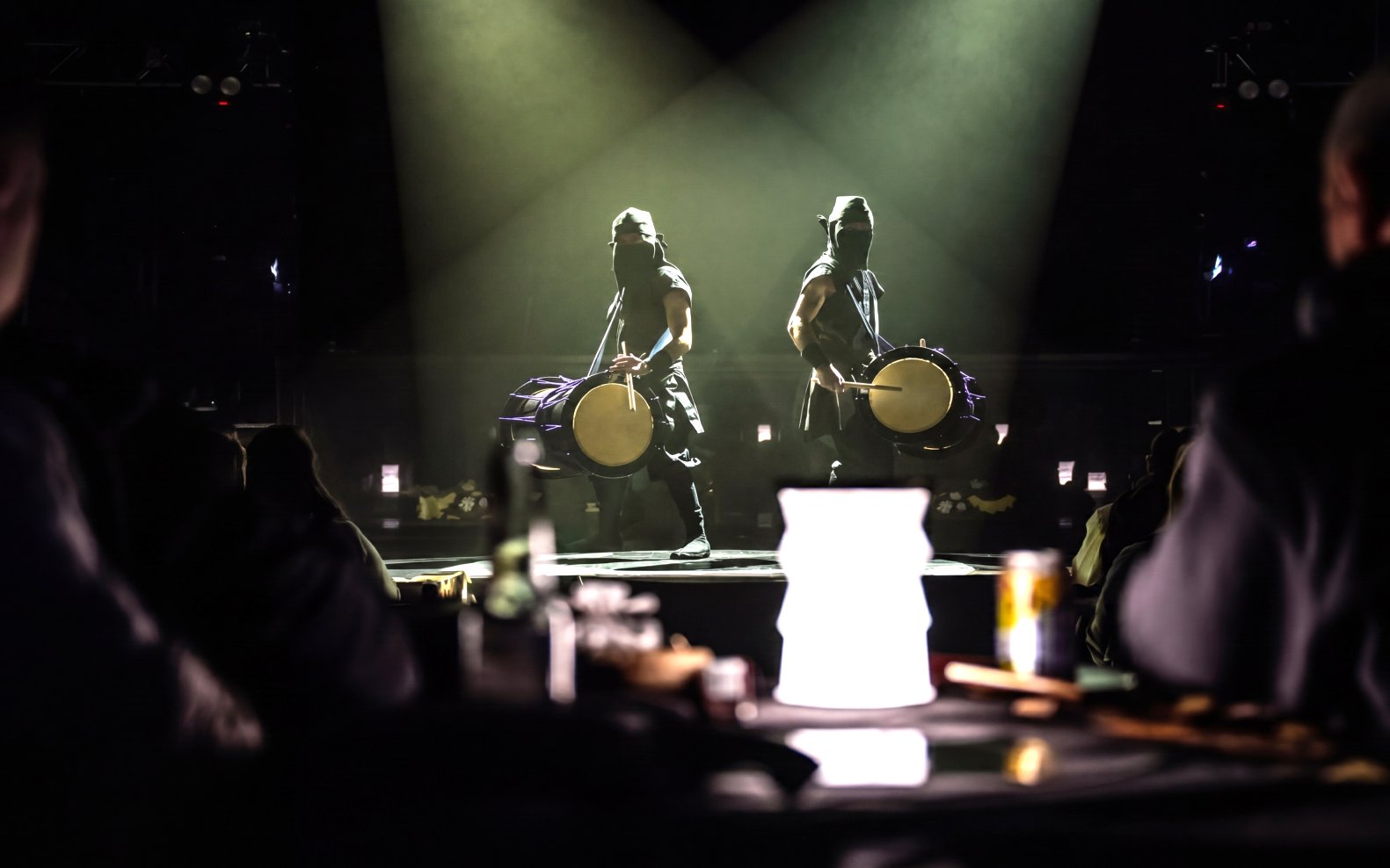 Drummers performing on stage in Tokyo, blending traditional and modern elements.
